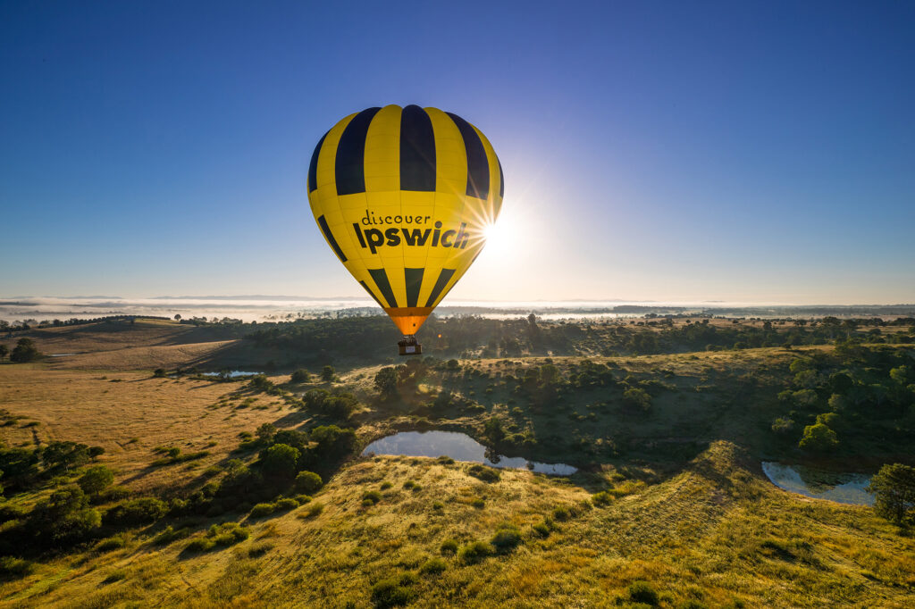 A yellow and black hot air balloon with 
