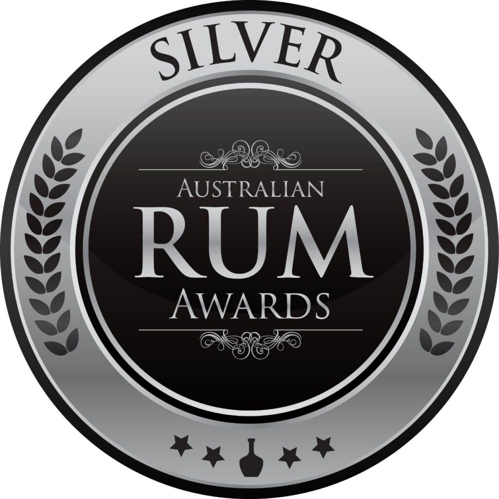 A round silver and black badge with "Australian Rum Awards" in the center and "Silver" at the top, decorated with laurel leaves.